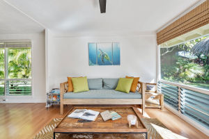 A cozy living room with wooden furniture 