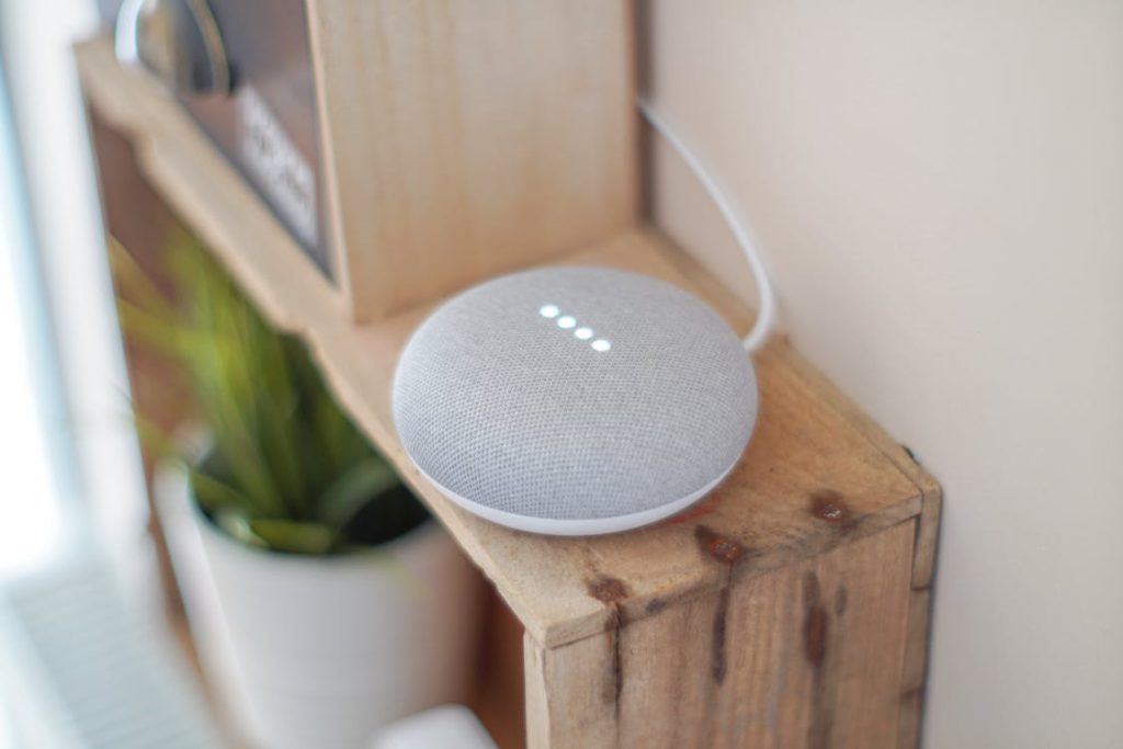 Round grey speaker on brown board